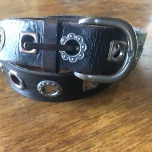 Black leather and brass belt.